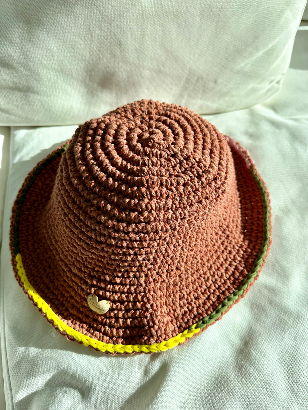 Alexa crochet hat in tabacco with green yellow and pink details