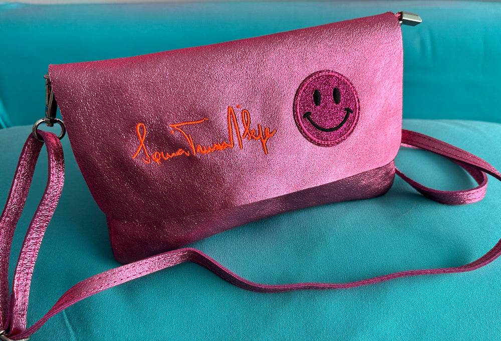 Smiley Leather Flap + Crossbody in Metallic Pink
